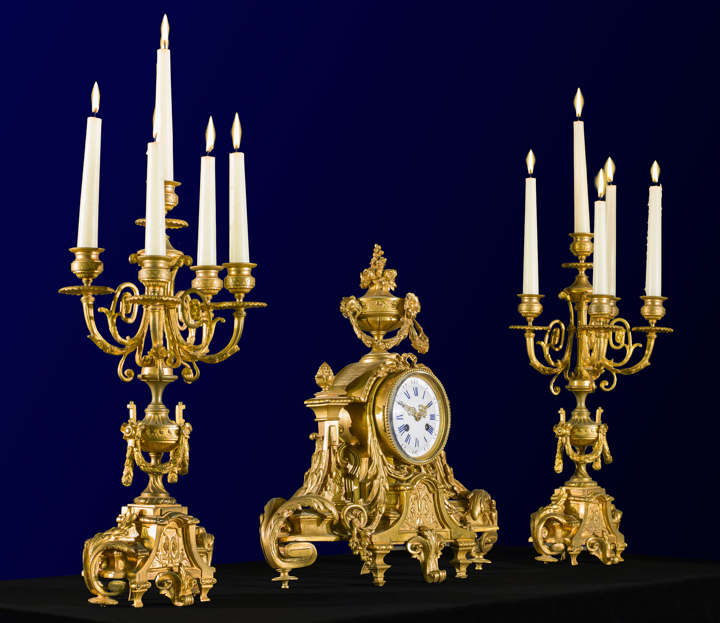 A  Gilt Bronze Rococo Style Clock Garniture