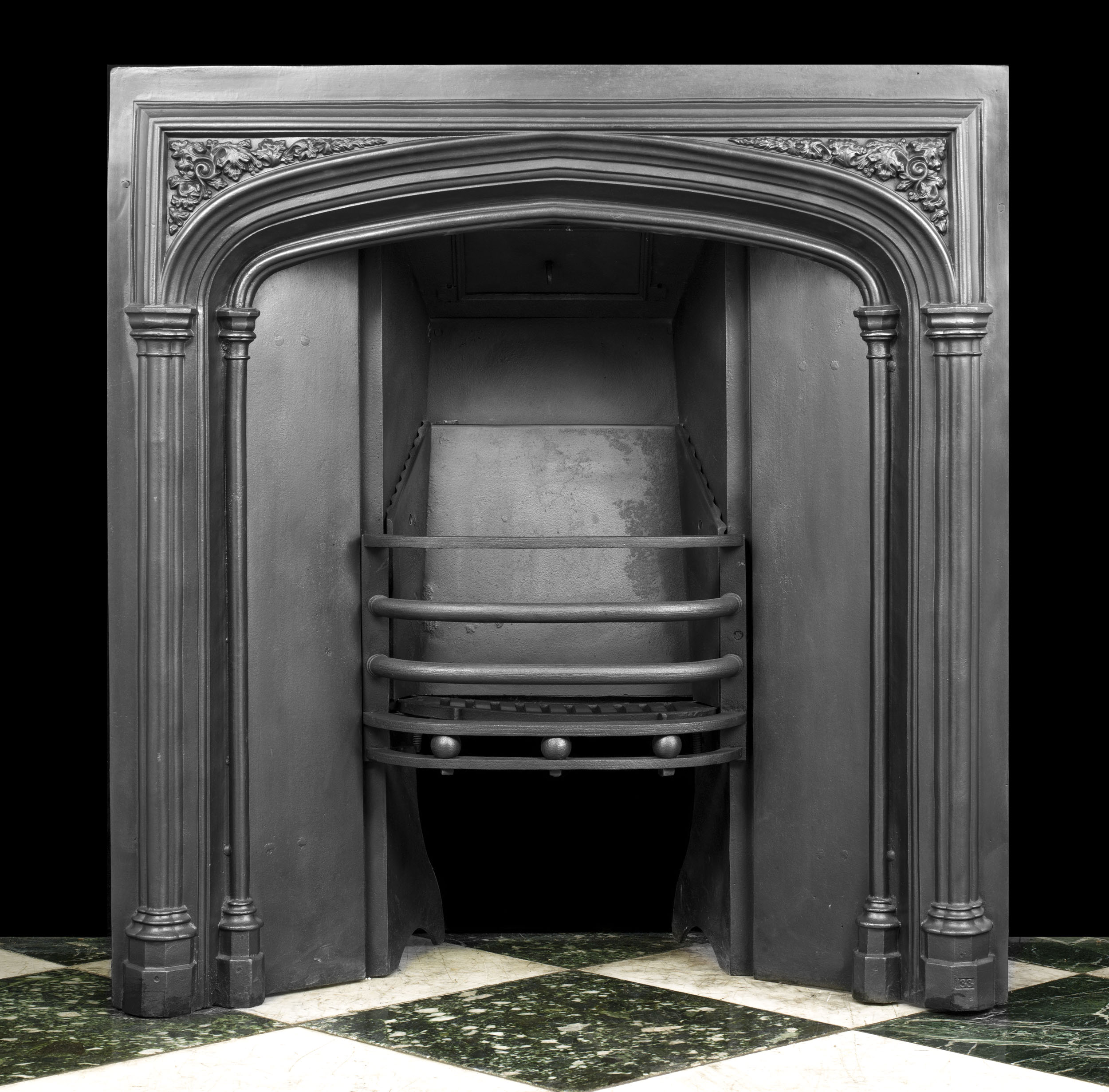  A Late Georgian Cast Iron Fireplace Insert