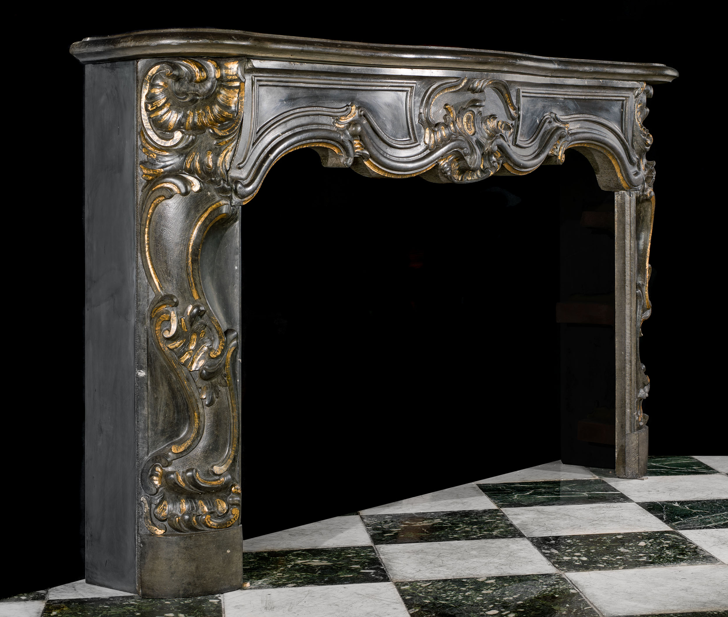 A Rococo Style Belgian Blue Stone Fireplace