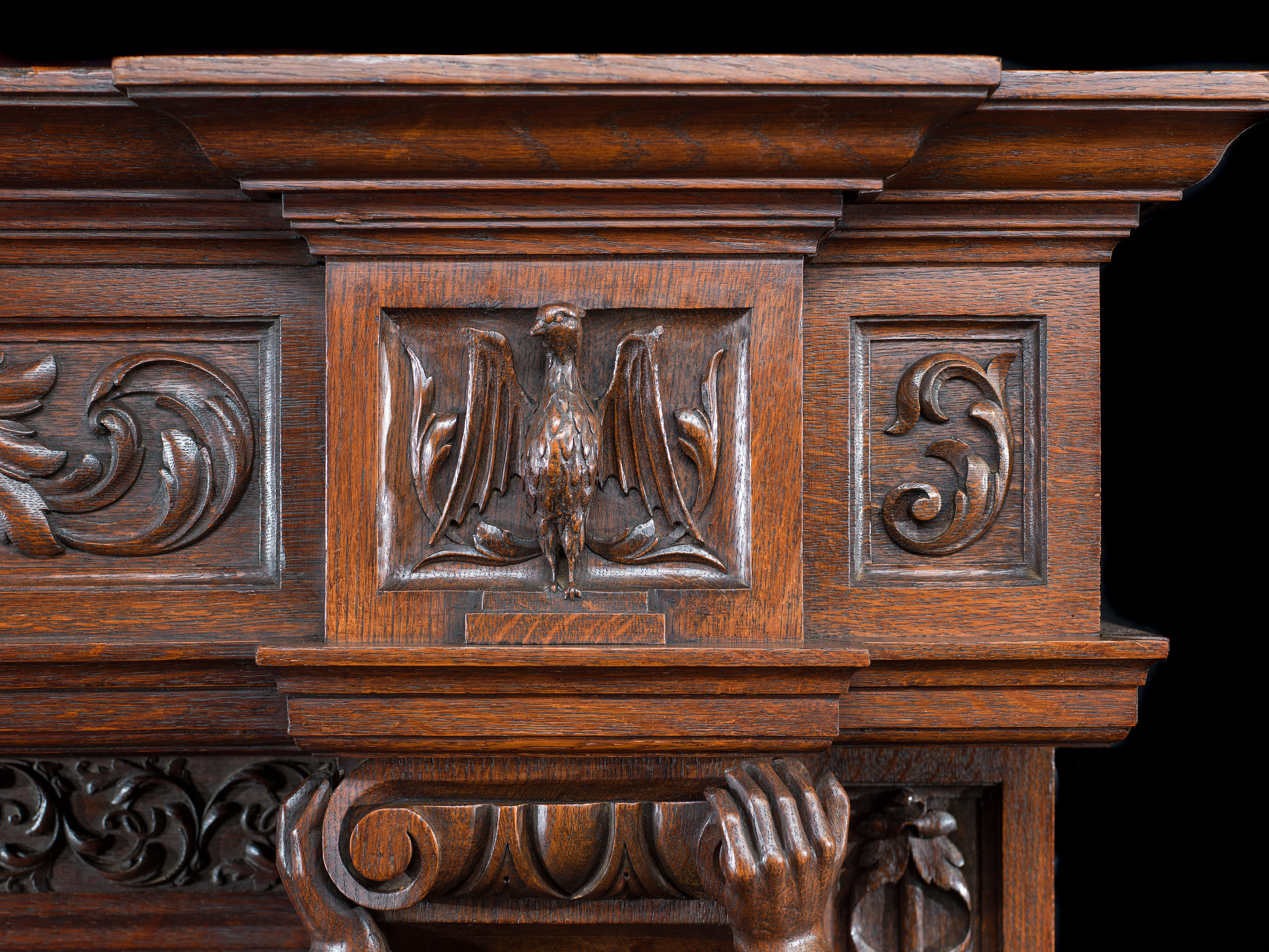 A large French carved Oak Renaissance style fireplace and insert.