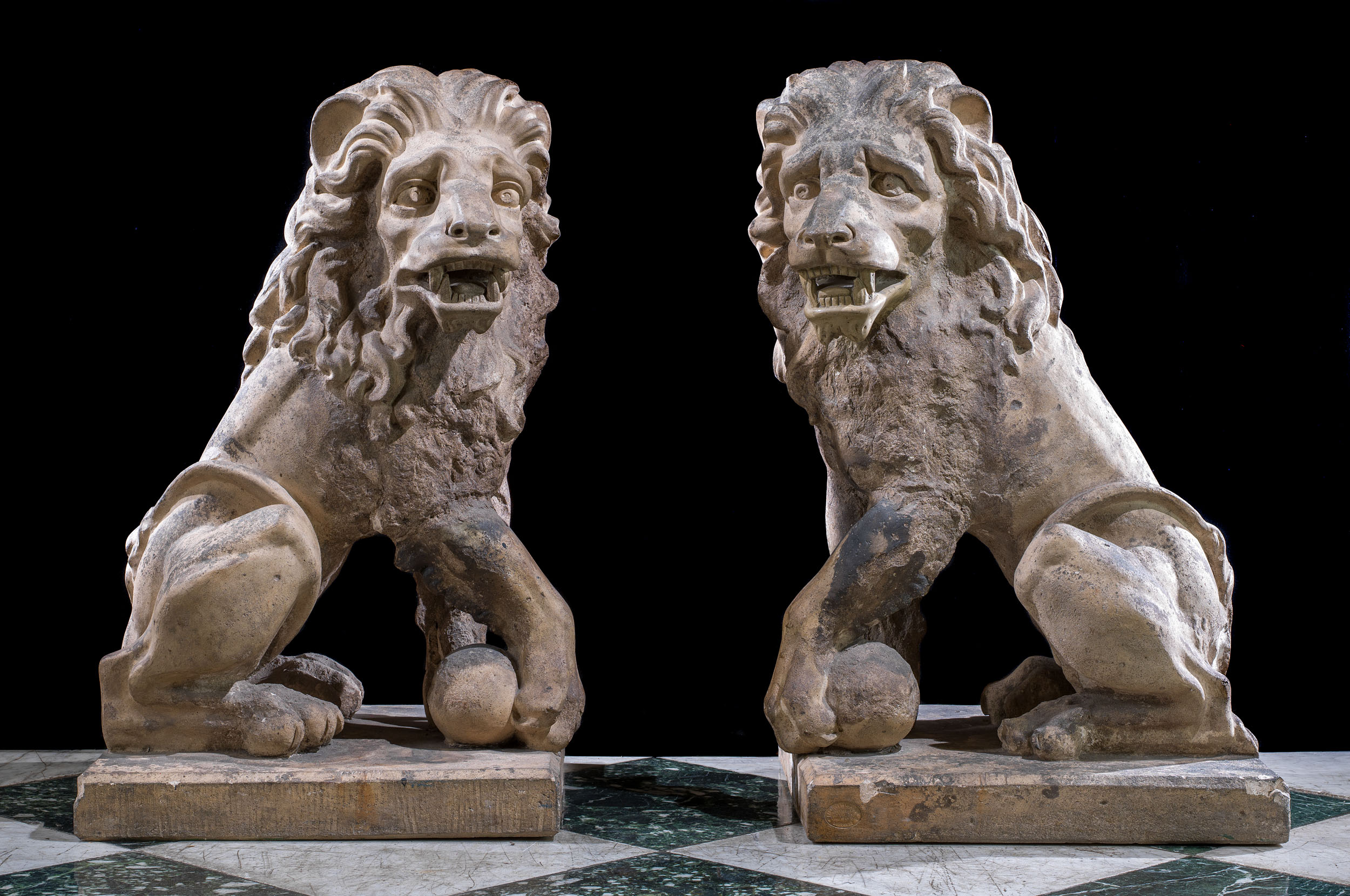  A pair of antique Baroque style terracotta lions

