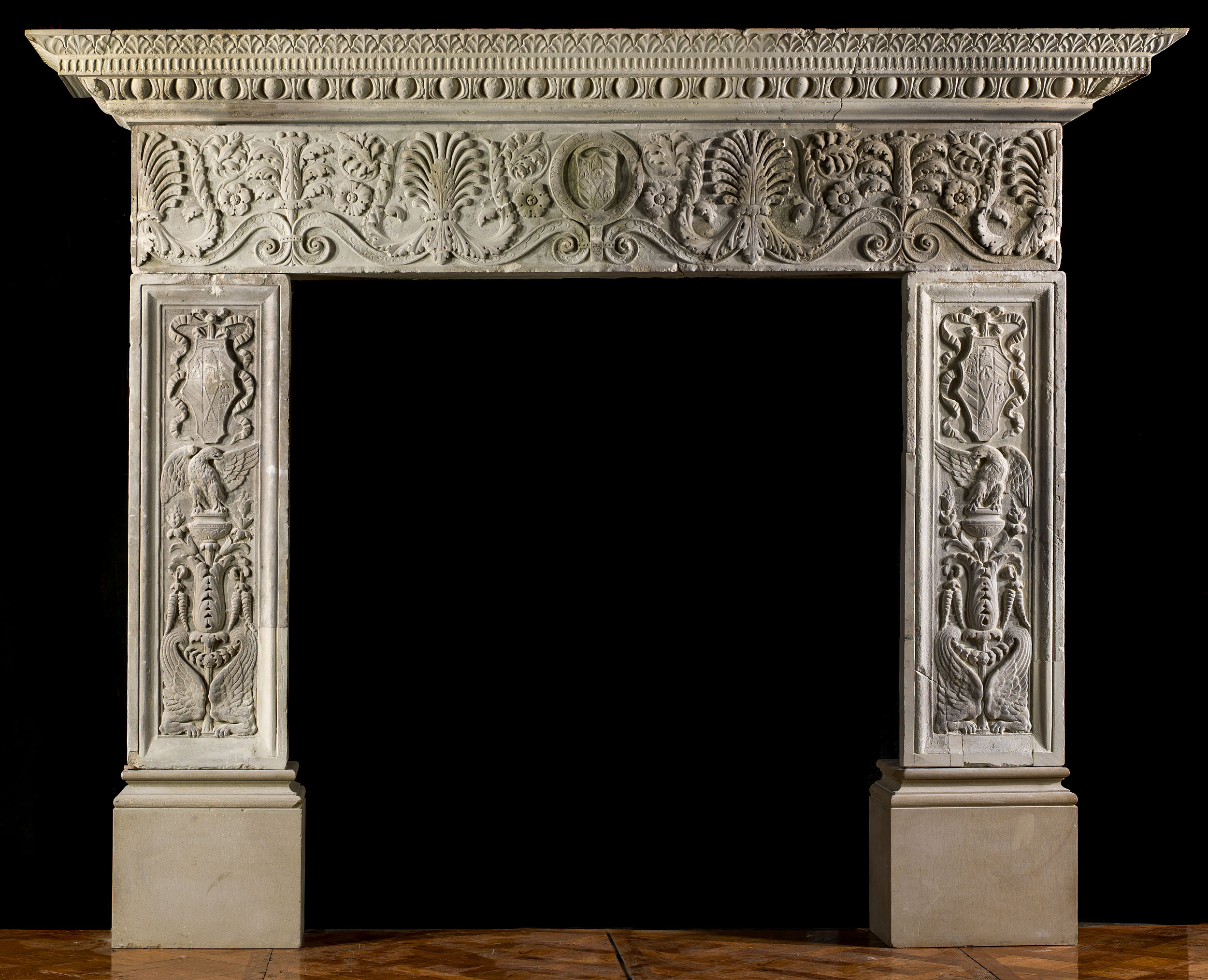 An Italian Renaissance style stone fireplace mantgel