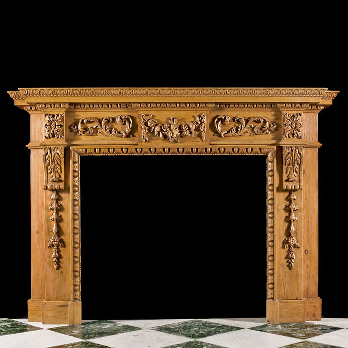 A Carved Pine Neoclassical Style Fireplace