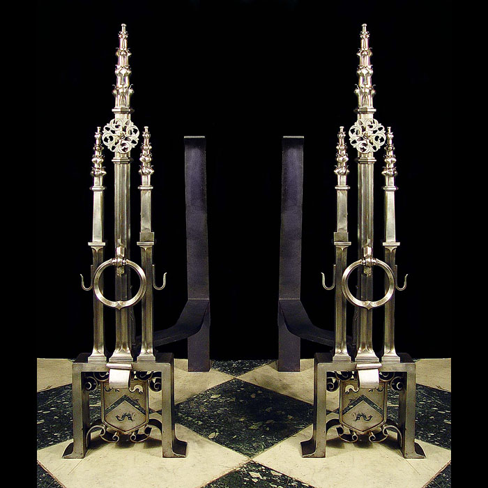 A superb pair of Reformed Gothic burnished steel andirons    