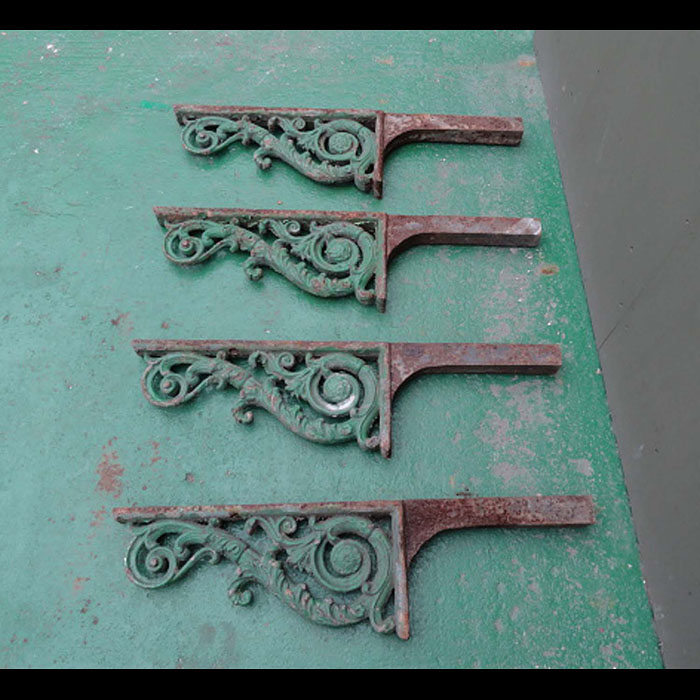 Set of four large cast iron balcony brackets

