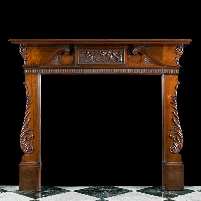 A Walnut Palladian Style Fireplace Mantel
