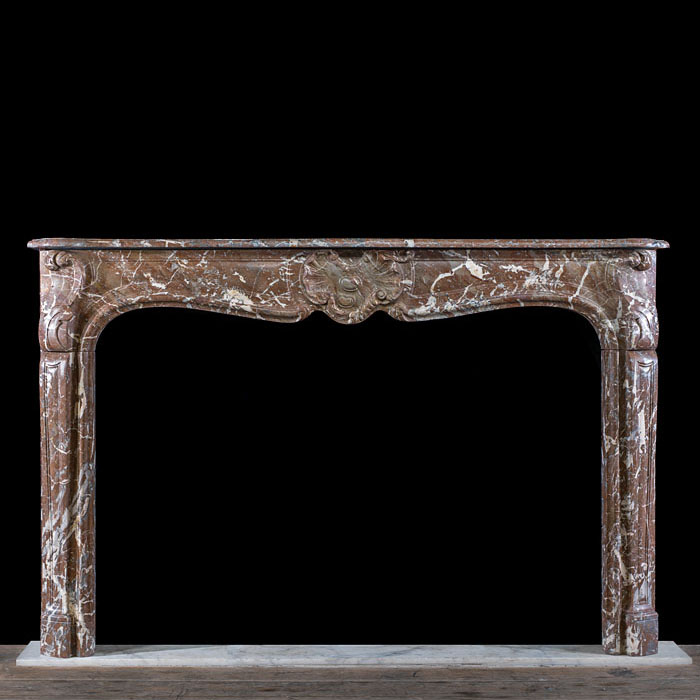 A Rouge Marble Louis XV Chimneypiece
