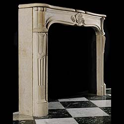 Antique Limestone Rococo Louis XV style French Chimneypiece 
