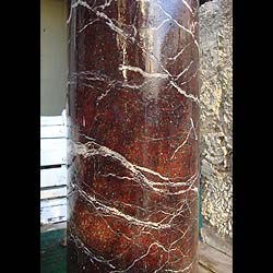  Pair of red marble columns with revolving tops
