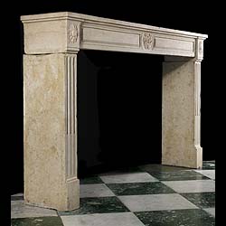 A Louis XVI Wide Limestone Chimneypiece
