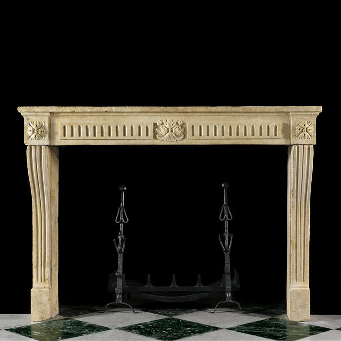 A Louis XVI Limestone Fireplace Surround
