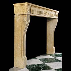 A Louis XVI Limestone Fireplace Surround
