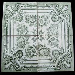 A suite of antique green and white Victorian floral tiles