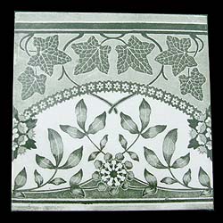 A suite of antique green and white Victorian floral tiles