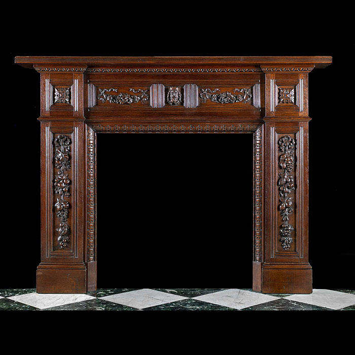 A carved oak antique Jacobean style chimneypiece 