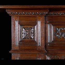 A carved oak antique Jacobean style chimneypiece 