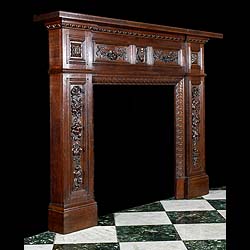 A carved oak antique Jacobean style chimneypiece 