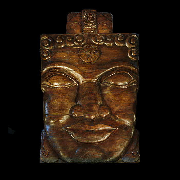 A massive teak sculpture of a Buddhist Deity
