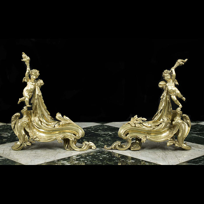 An Antique pair of Rococo style brass Chenets/Fire Dogs 