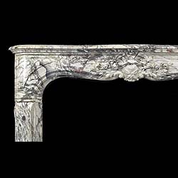 A fine and richly carved Louis XV Breche Violette Antique marble Cheminee Fireplace