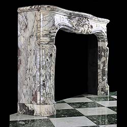 A fine and richly carved Louis XV Breche Violette Antique marble Cheminee Fireplace