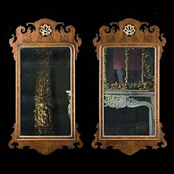 A replica pair of Chippendale style walnut wall mirrors    