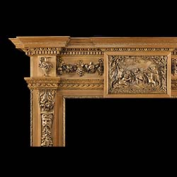 Antique Carved Pine and Limewood Fireplace in a Palladian style with decorative Putti 


