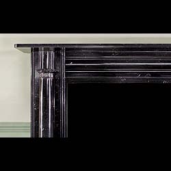 A Kilkenny Black Fossil Marble Fireplace