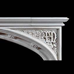 Antique Limestone Gothic Revival Chimneypiece in the Tudor manner with carved spandrels 


