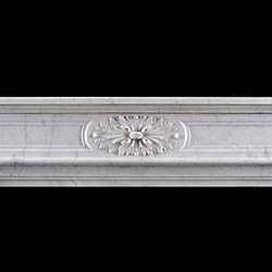 A small Carrara marble Louis XVI style antique chimneypiece