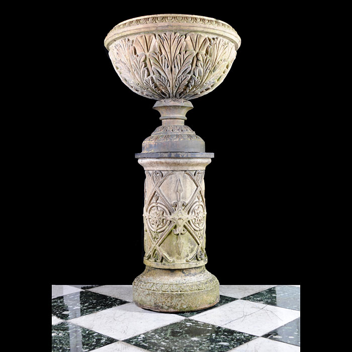 An antique terracotta urn and pedestal    