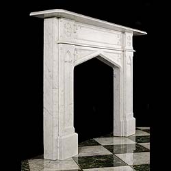An Antique Gothic Revival Carrara Marble Fireplace Surround