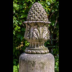  A pair of Pineapple topped antique terracotta pillars  