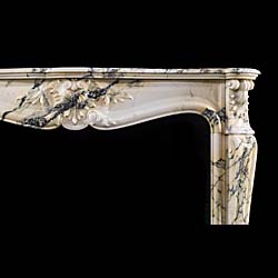 An Antique French Pavonazzetto Bianco Marble fireplace surround
