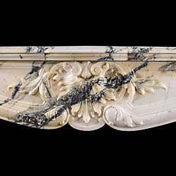 An Antique French Pavonazzetto Bianco Marble fireplace surround
