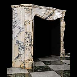 An Antique French Pavonazzetto Bianco Marble fireplace surround
