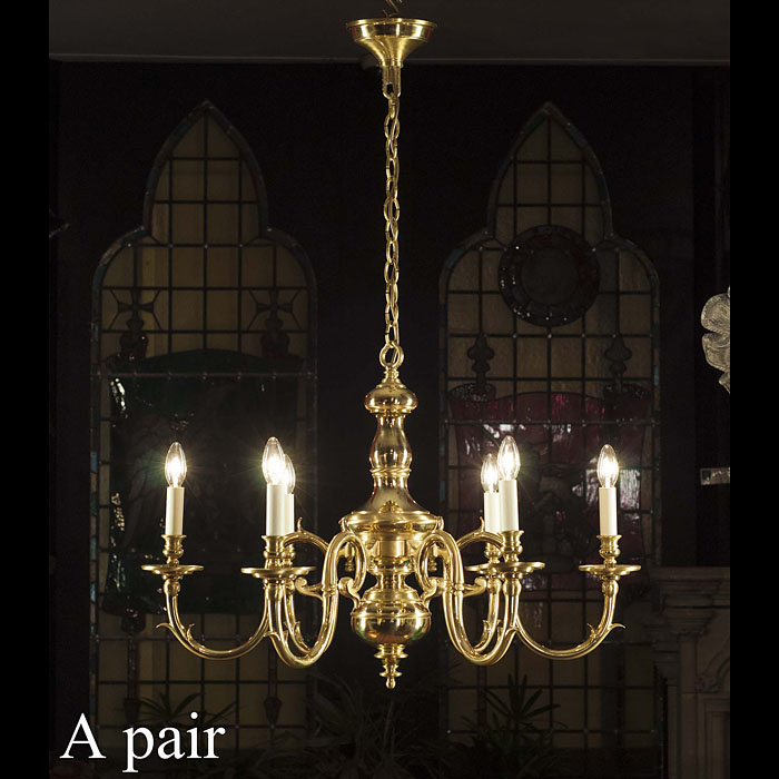 A pair of fine 20th century six branch brass chandeliers