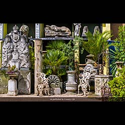 A Pair of Cast Iron Garden Urns on Plinths