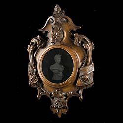 A Cartouche Shaped Mahogany Wall Mirror