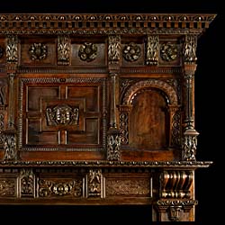 A Tall Carved Tudor Rose Oak Jacobean Revival chimneypiece