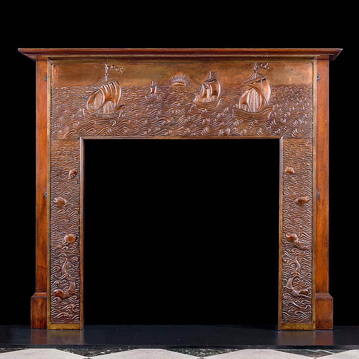 A repousse copper antique Fireplace Surround attributed to John Pearson