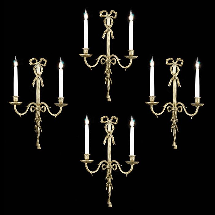 A set of four 2oth century Adam style wall lightsAntique 