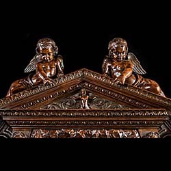 A very imposing Venetian Baroque style Antique walnut Chimneypiece 