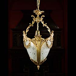 An Ornate Regency Style Brass Ceiling Light