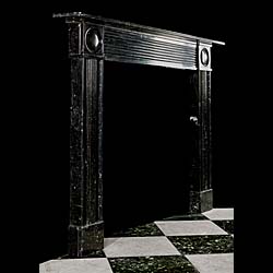 A Regency Black Fossil Marble Fireplace