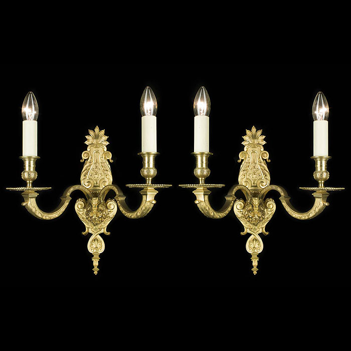 A gilt brass pair of twin branch wall lights