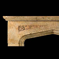 A carved stone 20th century fireplace mantel in the Tudor manner 