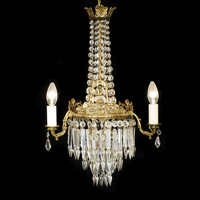 An Edwardian cut glass and brass chandelier
