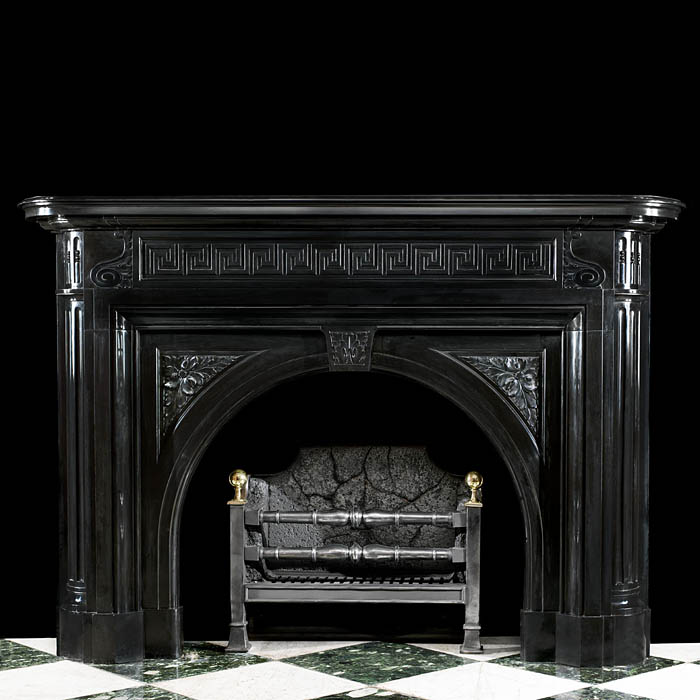 An antique Belgian Black Marble Regency Fireplace Surround 