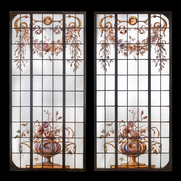 A pair of painted glass leaded windows